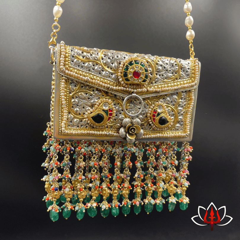 Silver sling bag with embossed flower and heavy beads