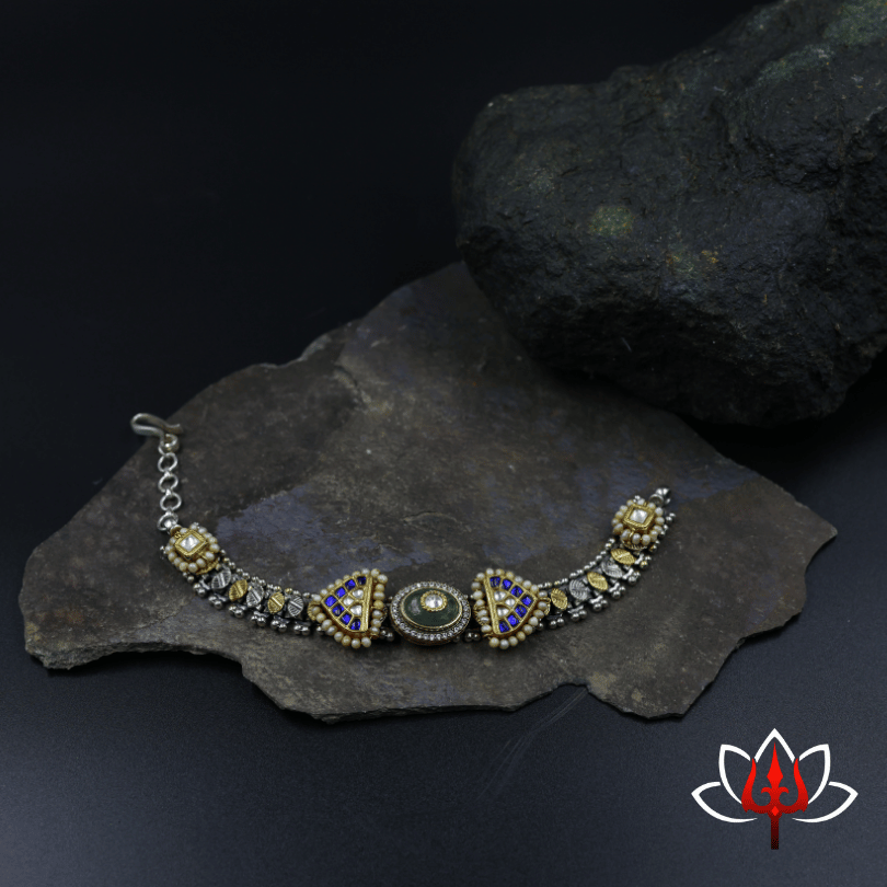 Silver sling bag with embossed flower and heavy beads