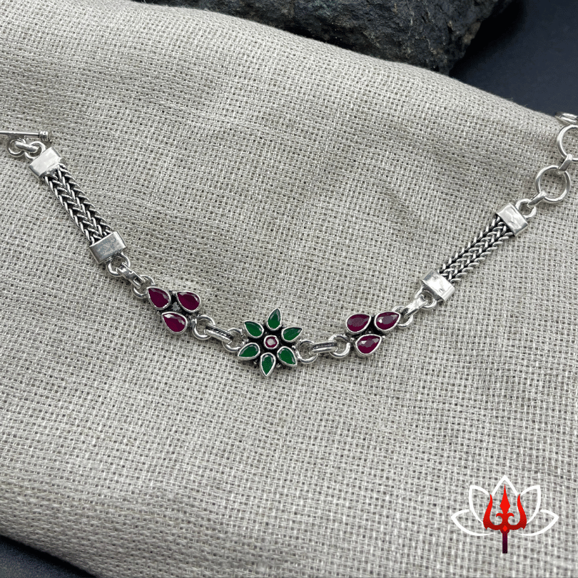 Elegant Silver Bracelet with Red & Green Stones