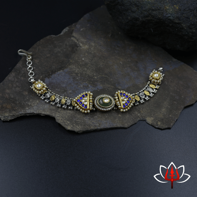 Silver sling bag with embossed flower and heavy beads